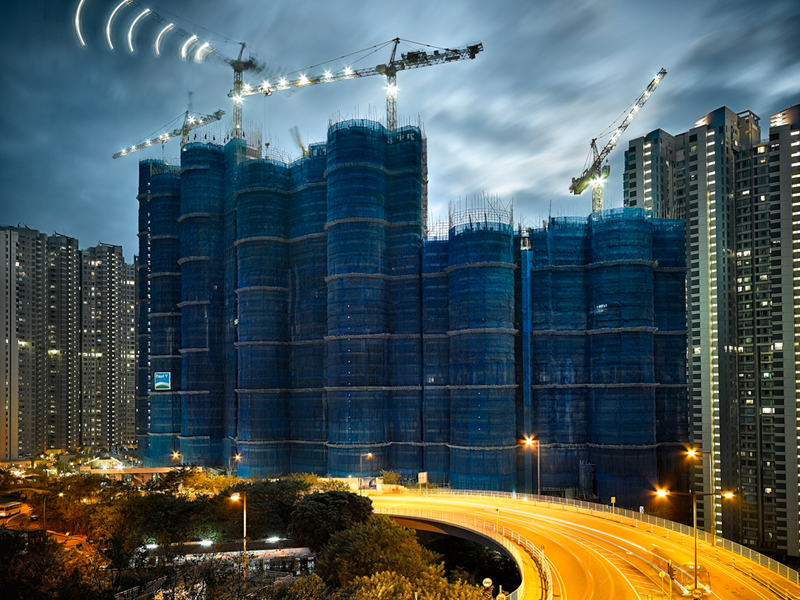 Illustration for article titled The Surreal Sight of Skyscrapers Encased in Colored Fabric